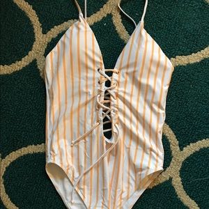 Yellow and white striped one piece bathing suit